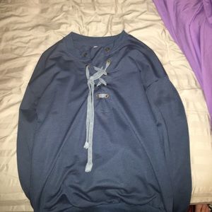 Long sleeve crewneck with tie up front.